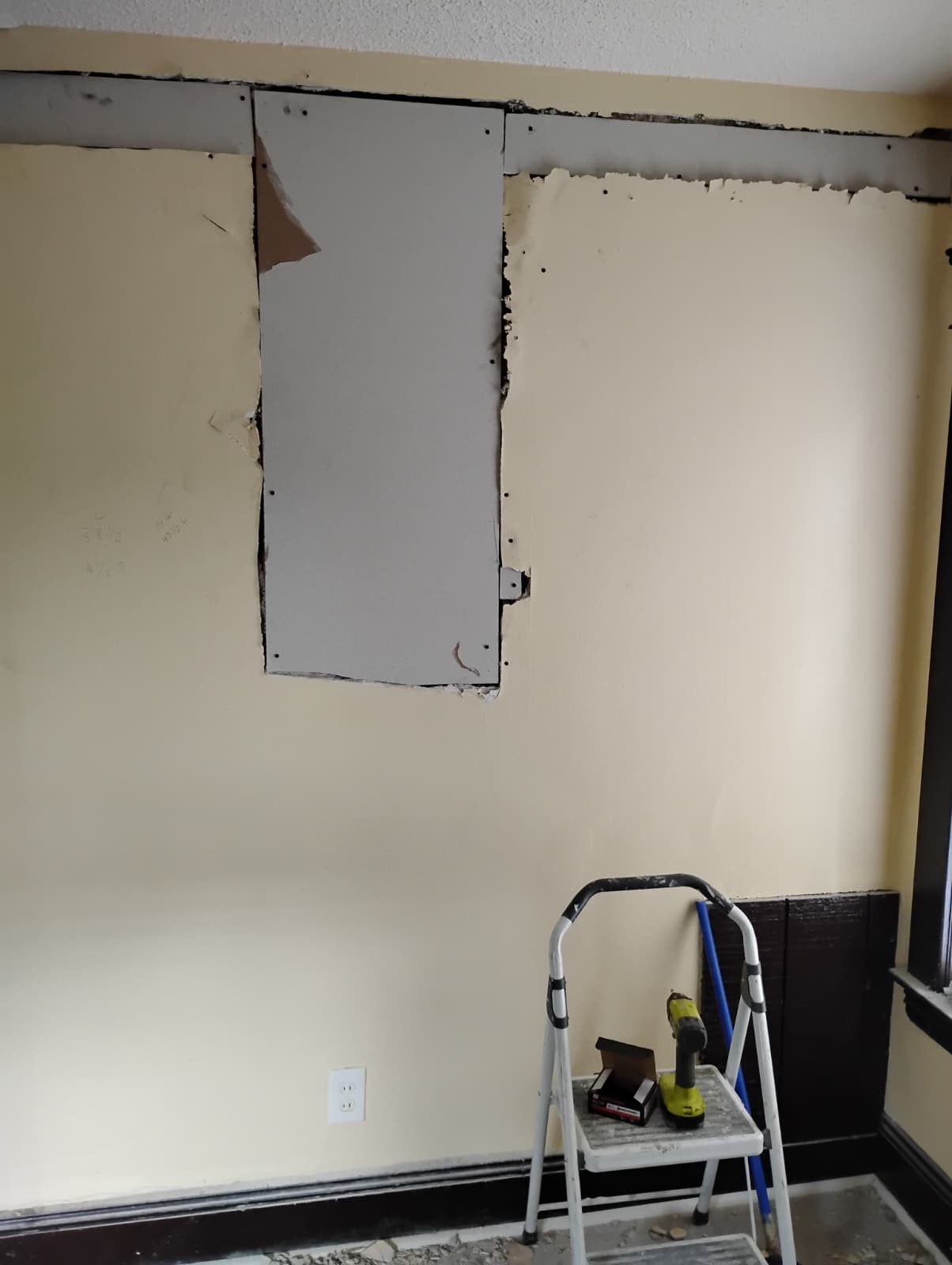 Fresh drywall closing up the rebuilt walls