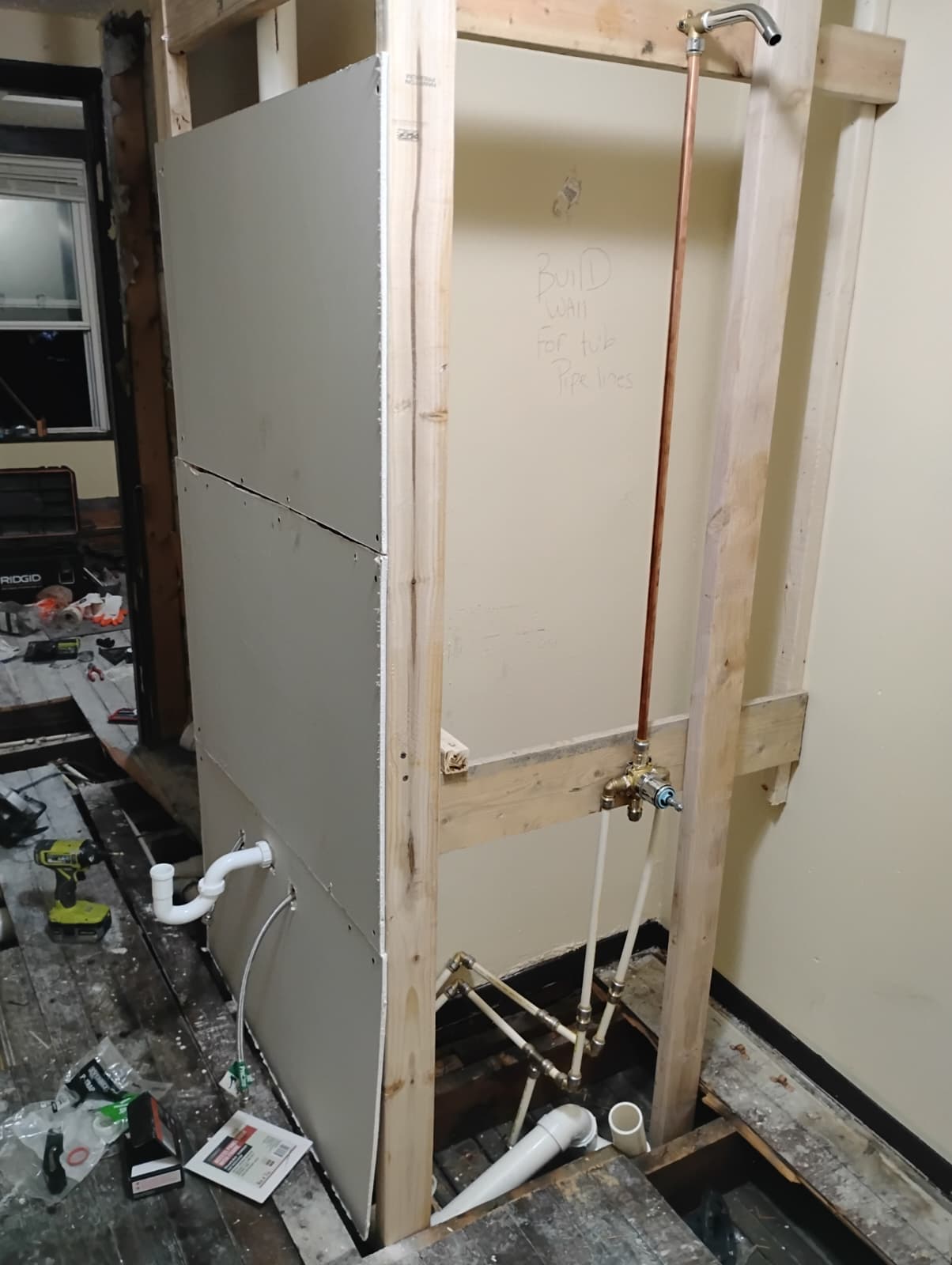 Fresh drywall on the rebuilt partition wall