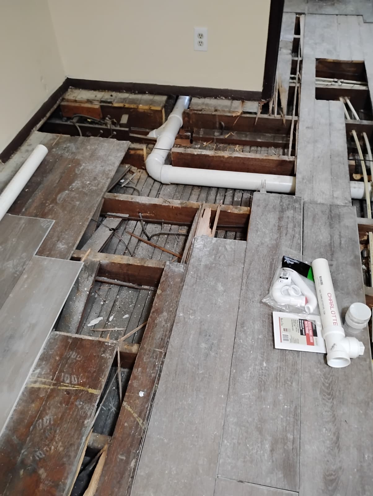 Fresh drain piping and fittings laid out during rough-in